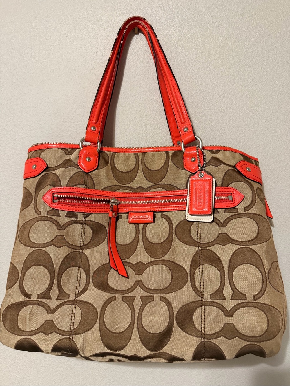 Coach Daisy Outline Signature Emma Tote with vibrant orange